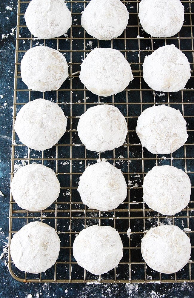 Mexican Wedding Cookies are buttery pecan cookies rolled in confectioners sugar, making them look just like snowballs. They are the perfect Christmas cookie, add them to your holiday baking list this year. #cookies #Christmascookies #holidays #baking